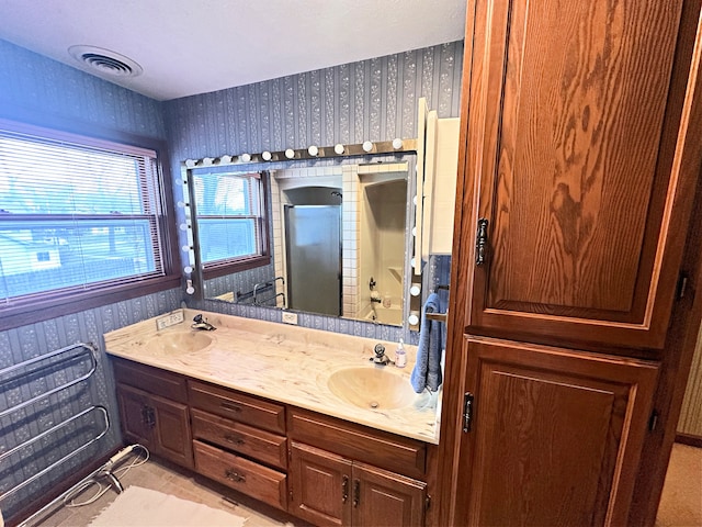 bathroom with tile patterned flooring and vanity