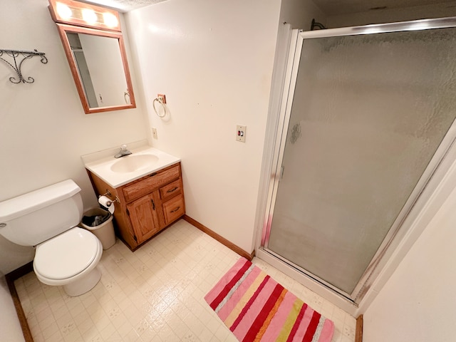 bathroom with vanity, toilet, and walk in shower