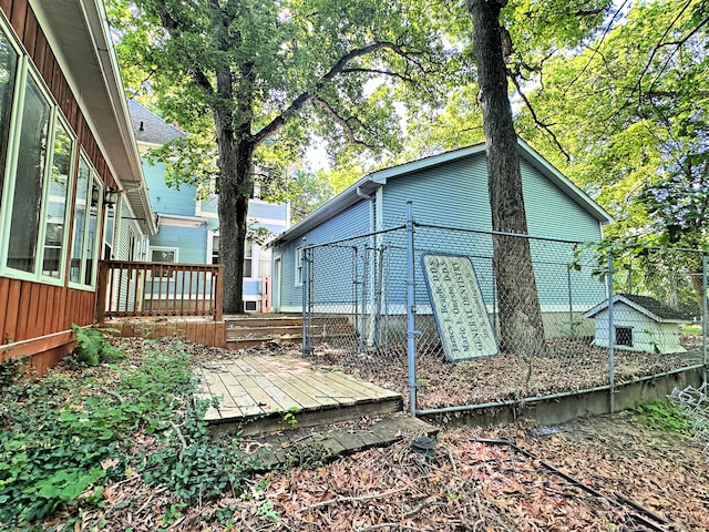 back of property featuring a deck