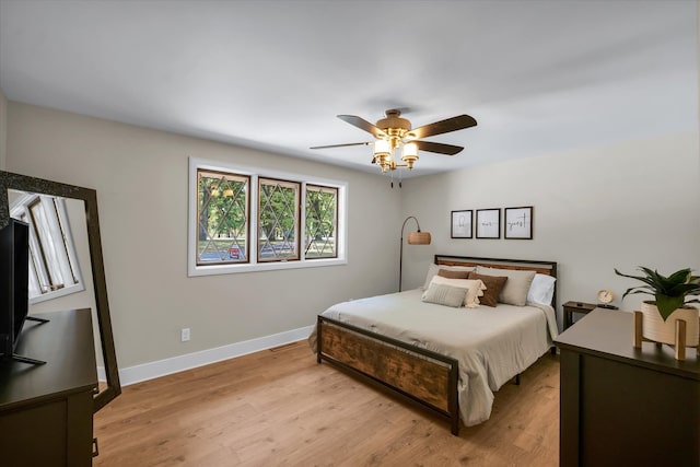 bedroom featuring ceiling fan and light wood-type flooring