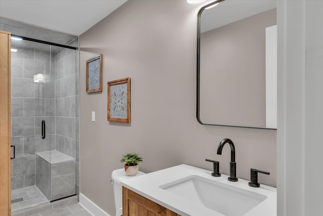 bathroom with vanity, tile patterned floors, and a shower with door