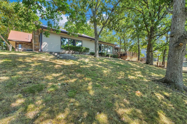 view of yard with a wooden deck