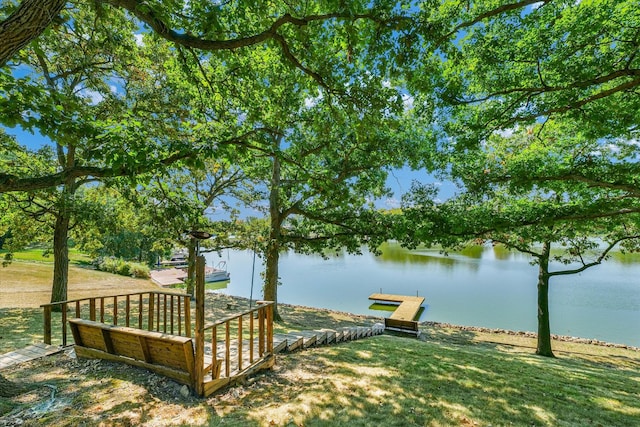 exterior space with a dock and a water view