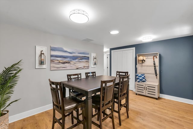 dining space featuring light hardwood / wood-style flooring