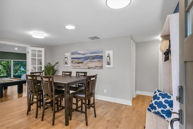 dining room with light hardwood / wood-style flooring