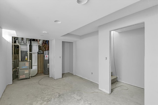 basement featuring electric water heater and heating unit