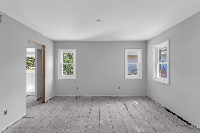 unfurnished room featuring light hardwood / wood-style floors