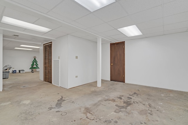 basement featuring a drop ceiling