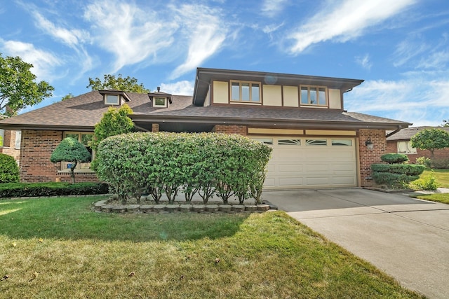 view of front facade with a garage and a front yard