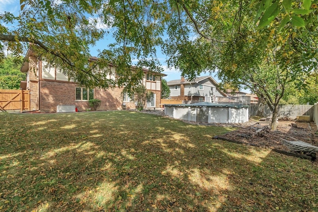 view of yard featuring a covered pool