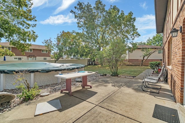 view of patio featuring a covered pool