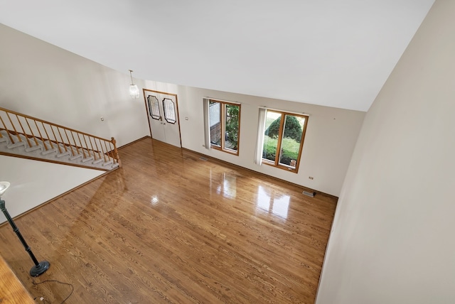 unfurnished living room featuring hardwood / wood-style floors