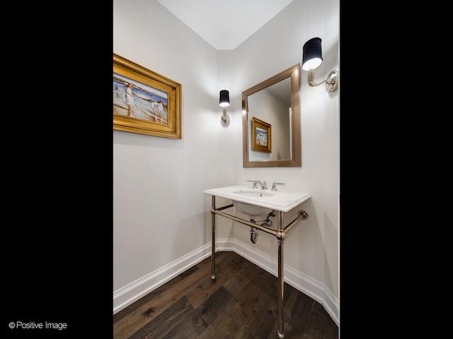 bathroom with hardwood / wood-style flooring