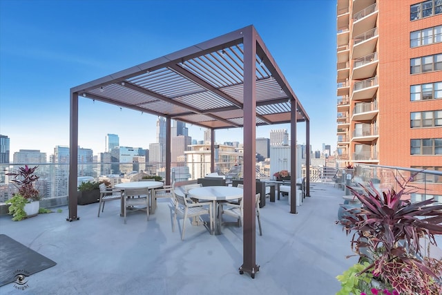 view of patio / terrace with a balcony and a pergola