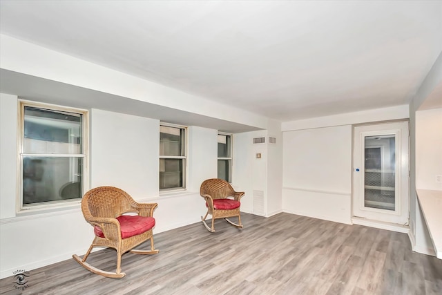 sitting room with light hardwood / wood-style floors