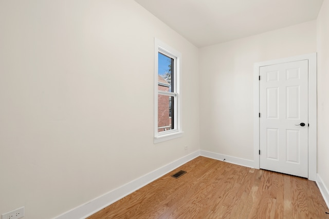 spare room featuring light wood-type flooring