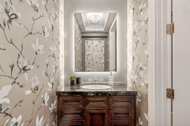 bathroom featuring crown molding and vanity