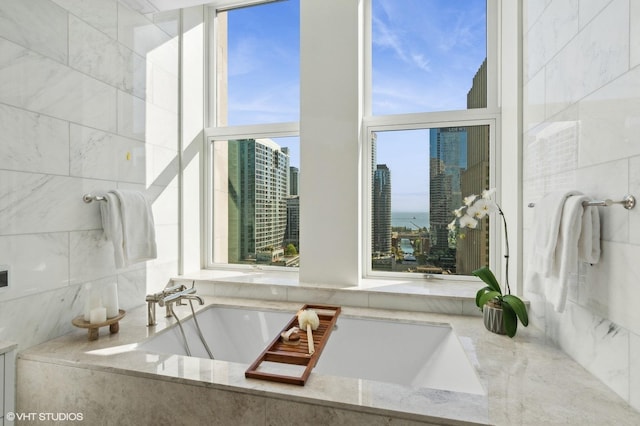 bathroom featuring a relaxing tiled tub