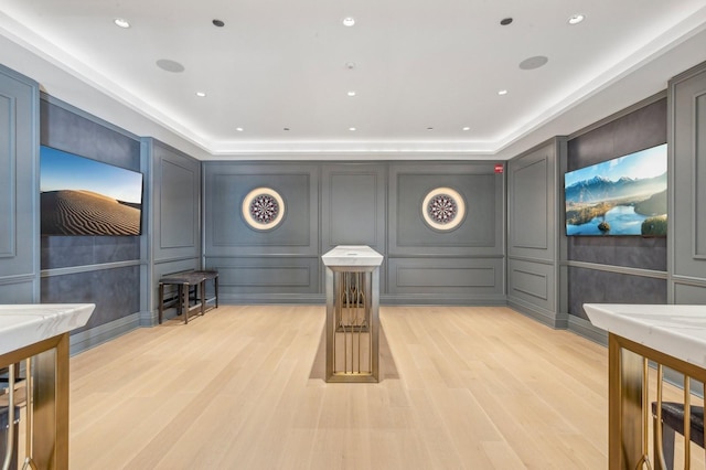 cinema room with light wood-type flooring