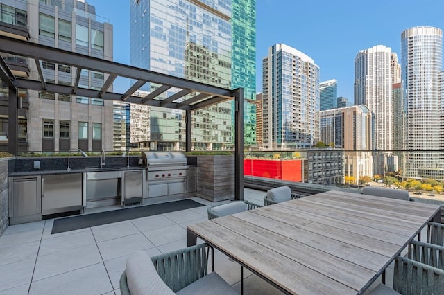 view of patio / terrace featuring sink, a pergola, and area for grilling