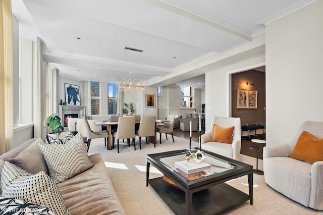 living room with a notable chandelier and crown molding