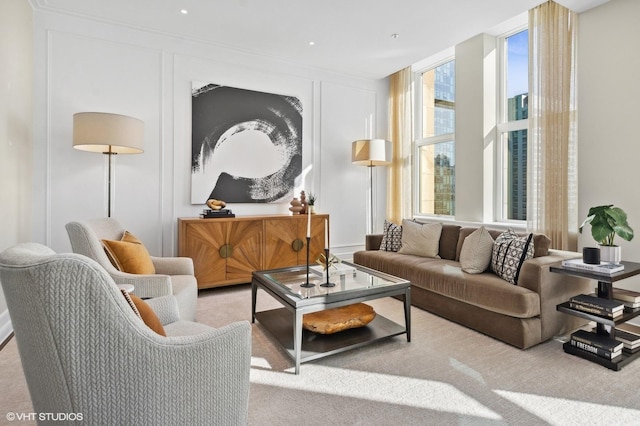 interior space featuring plenty of natural light and light colored carpet