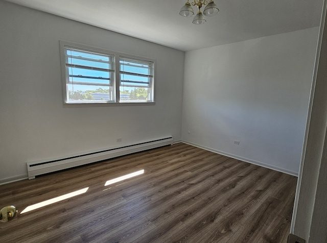 spare room with a wall mounted AC and hardwood / wood-style flooring