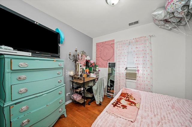 bedroom featuring hardwood / wood-style flooring