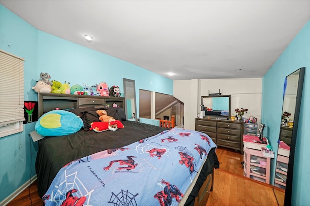 bedroom featuring hardwood / wood-style floors