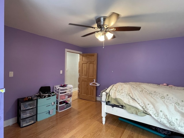 bedroom with ceiling fan and light wood-type flooring