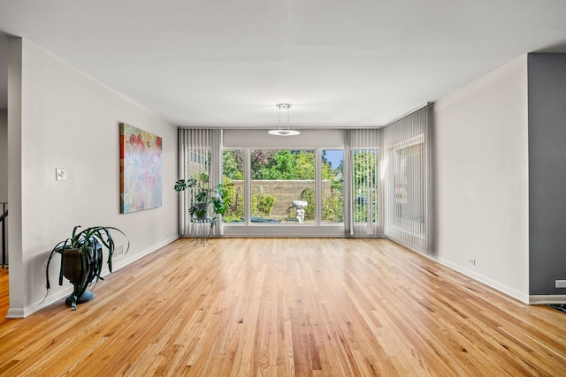 spare room with light wood-type flooring