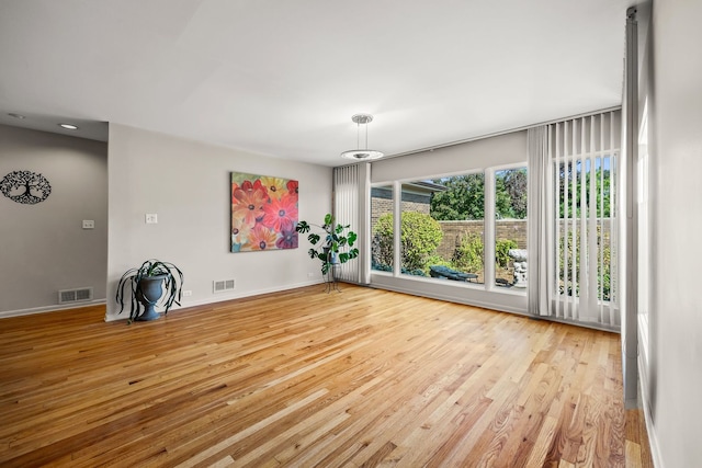 empty room with light hardwood / wood-style floors