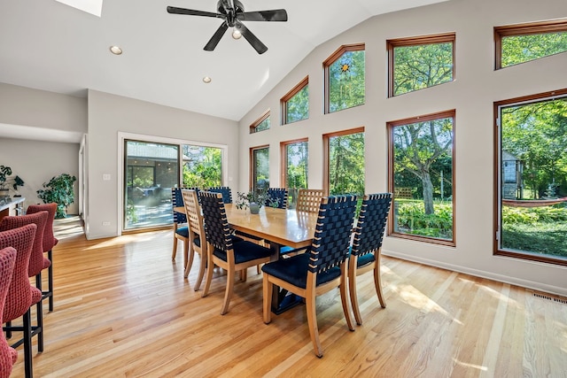 dining room with light wood-type flooring, ceiling fan, and plenty of natural light