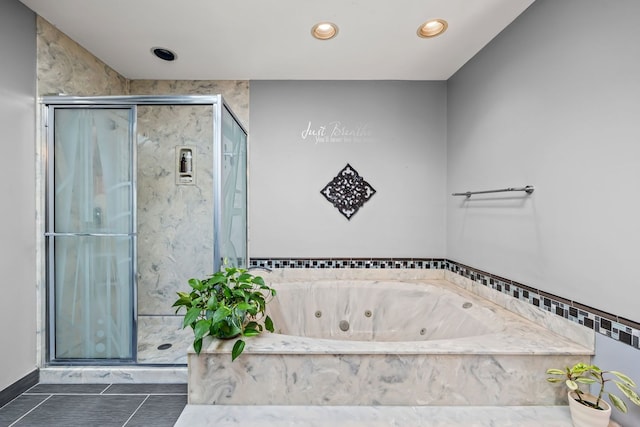 bathroom featuring shower with separate bathtub and tile patterned floors