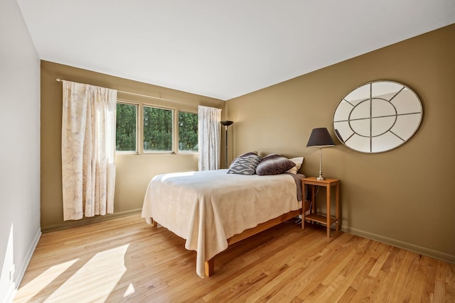 bedroom with light wood-type flooring