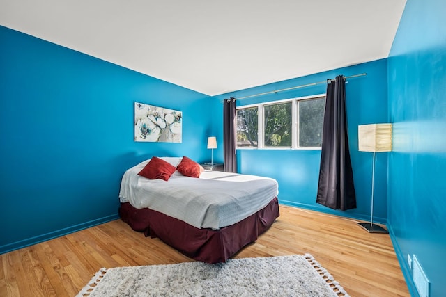 bedroom with light hardwood / wood-style floors