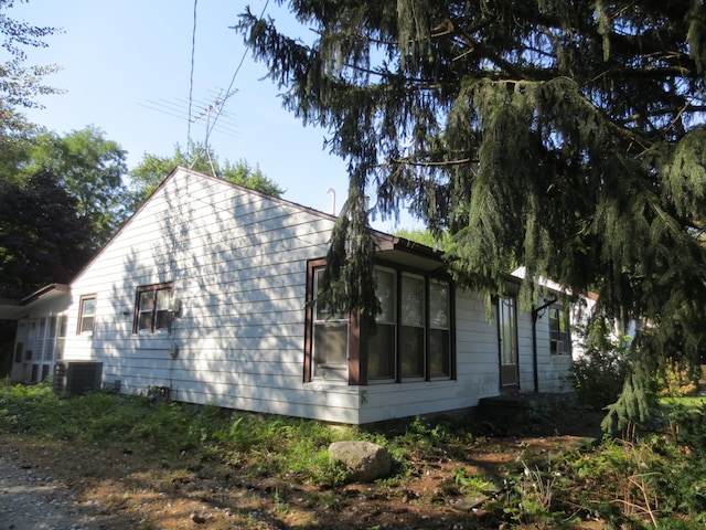 view of home's exterior with central AC unit