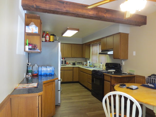 kitchen featuring hardwood / wood-style floors, sink, and black range with electric stovetop