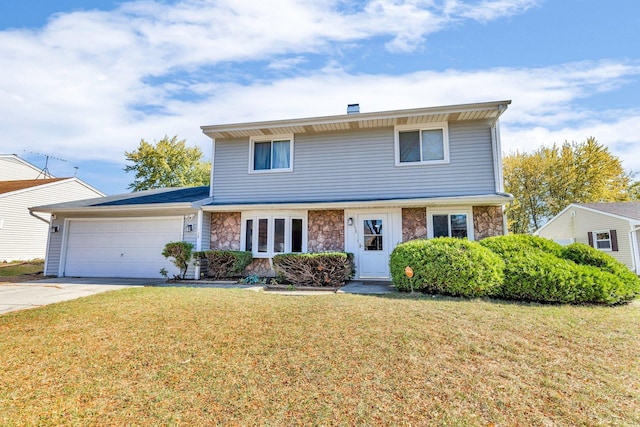 front facade featuring a front lawn and a garage