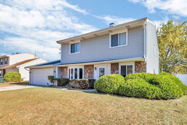 view of front of home featuring a front lawn and a garage