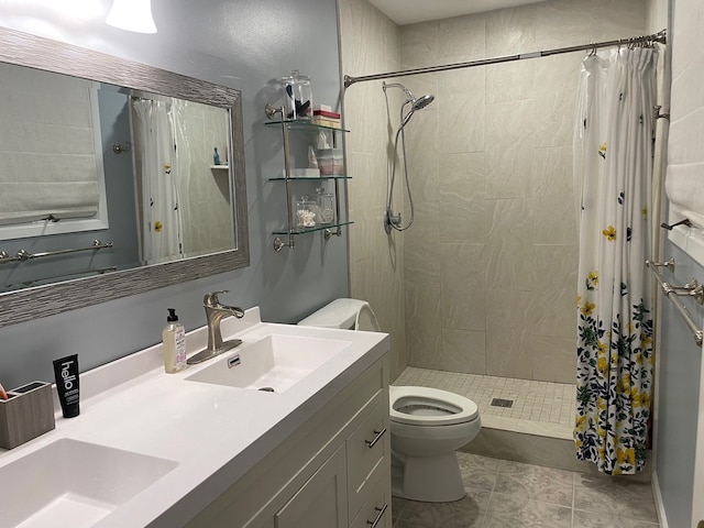 bathroom featuring a shower with shower curtain, tile patterned flooring, vanity, and toilet