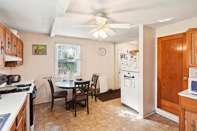 kitchen featuring ceiling fan, beamed ceiling, and white appliances