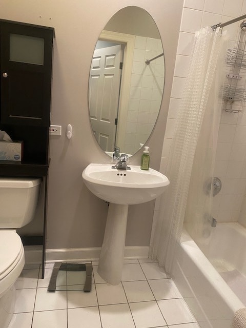 full bathroom with toilet, sink, shower / tub combo, and tile patterned floors