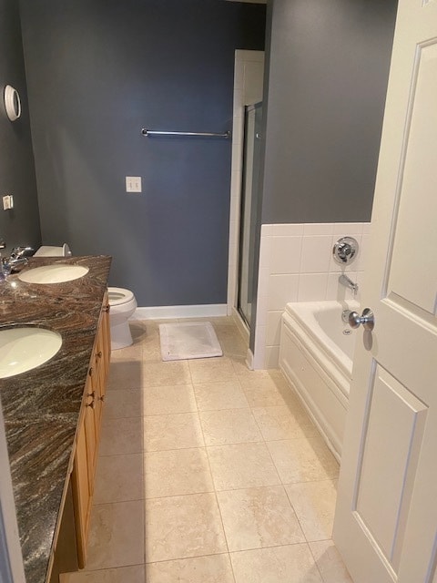 full bathroom featuring tile patterned flooring, vanity, toilet, and plus walk in shower