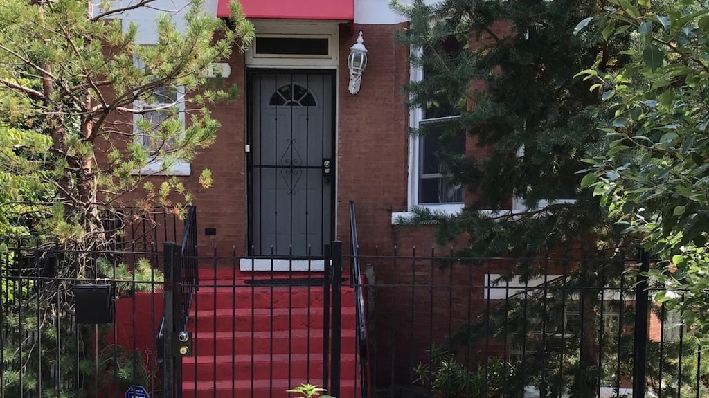 1113 S Saint Louis Ave, Chicago, IL 60624 - entrance to property featuring a gate and brick siding
