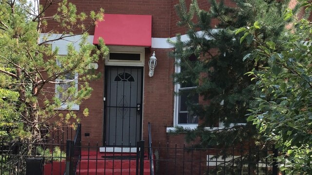1113 S Saint Louis Ave, Chicago, IL 60624 - property entrance with brick siding and a gate