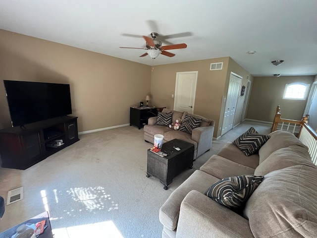 carpeted living room featuring ceiling fan