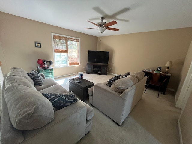 living room featuring ceiling fan and light colored carpet