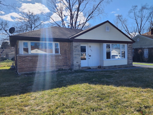 bungalow-style home with a front lawn