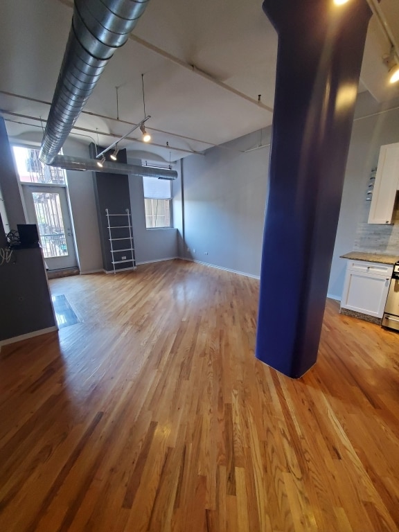 unfurnished living room featuring light hardwood / wood-style flooring